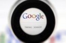 A Google search page is seen through a magnifying glass in this photo illustration taken in Brussels