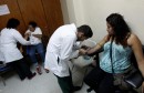 Health personnel extract blood from pregnant women as part of a general routine check, which includes examination for mosquito-borne viruses like Zika, at the maternity ward of the Hospital Escuela in Tegucigalpa