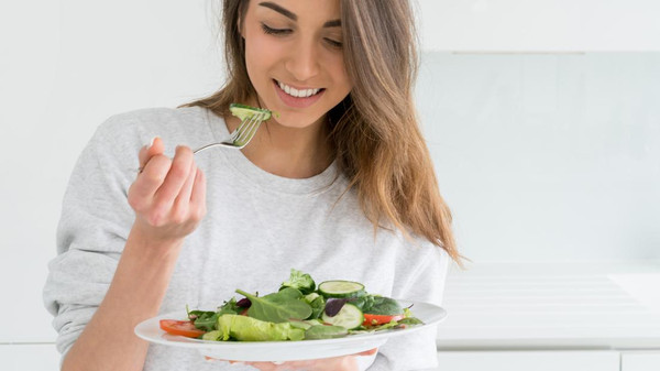 Woman dieting and eating a salad